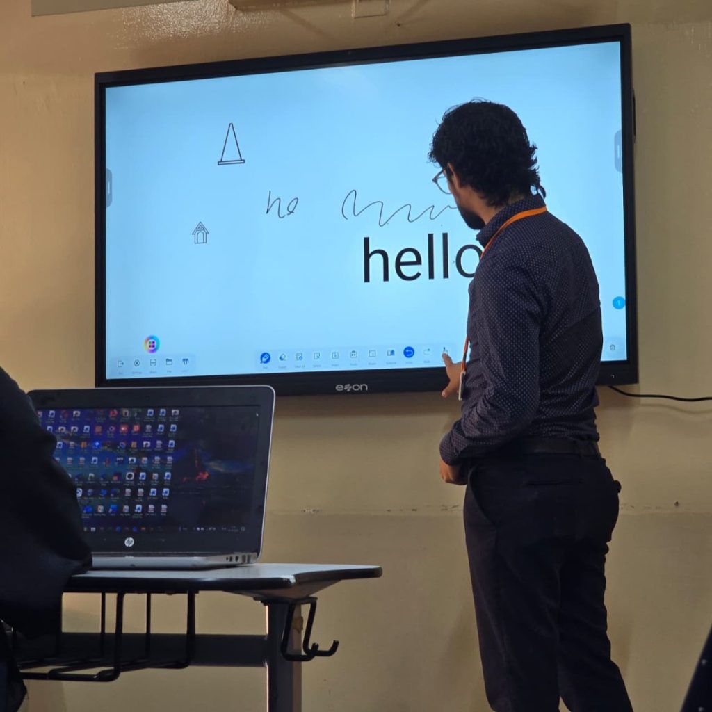 Teacher annotating on an eZon Interactive Flat Panel